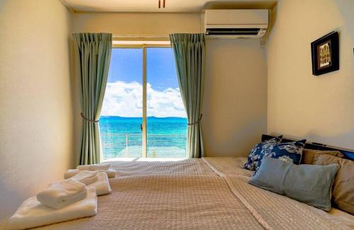 Kin Villa | 【エメラルド色の海が目の前に！】自然を満喫できるロケーション。お洒落な感じの4LDK一軒家貸し切り！