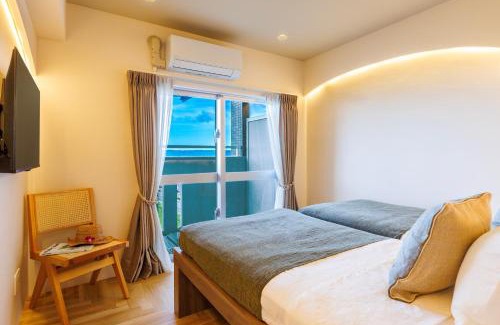Yonabaru Apartamento | オーシャンビュー窓から見える景色を想い出にThe琉球タワー10A