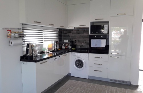 Sogucak Apartamento | Apartamento de lujo 1 + 1 en Kusadasi Sogucak, frente al mar Egeo de color turquesa