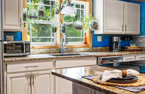 Chimney Rock Casa | 1920s artsy cottage with Chimney Rock views, yard, sauna, & firepit - dogs ok