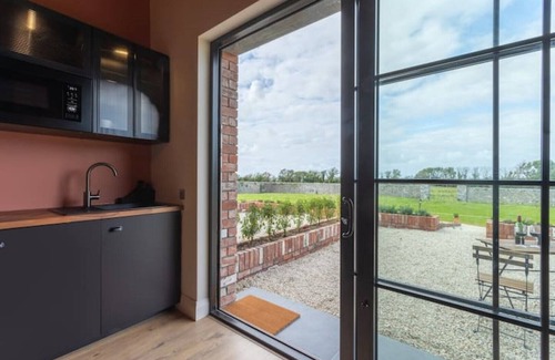Roscoe Cabaña | 19th century restored Irish stable by the lake