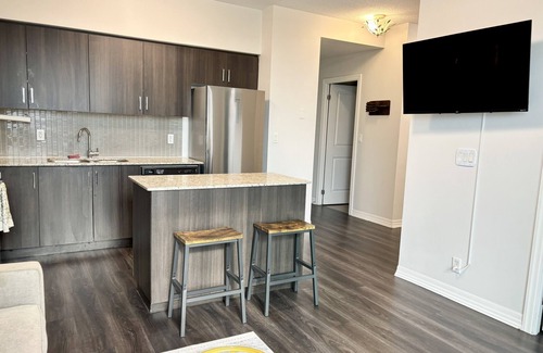 Rexdale Condominio | 1BR+Den Near YYZ with Workspace