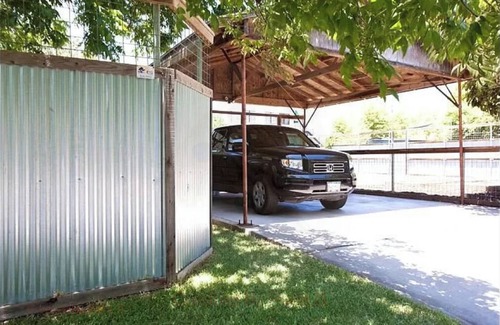 North Loop Casa | 2-3 BR house with big fenced yard & private carport