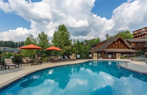 Pigeon Forge Casa | 2 Miles from Dollywood Family Resort with Seasonal Outdoor Swimming Pool, Year around Heated Indoor Swimming Pool, Townhome Style Cabin, Private Hot Tub, Arcade, TV, Wifi, Kitchen with Refrigerator, Washer and Dryer