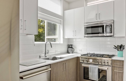 Minor Casa | 2BR Townhome w/ City Skyline Views & Easy Parking!