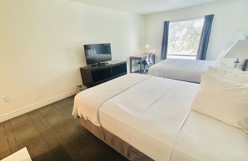 Cuero Casa | 3 Double Queen With Kitchenette at FairBridge Inn & Suites Cuero, Pet-Friendly!