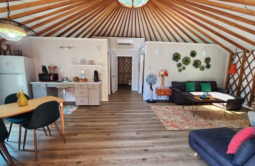 Mill Spring Casa | 30' ADA Yurt with a large deck, on the creek, full kitchen, dome skylight, dog friendly, 2 bedrooms, sleeps 5.