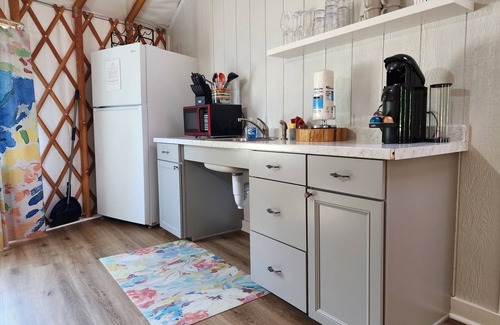 Mill Spring Casa | 30' ADA Yurt with a large deck, on the creek, full kitchen, dome skylight, dog friendly, 2 bedrooms, sleeps 5.