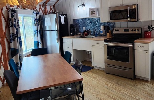 Mill Spring Casa | 30' Yurt with a large deck, on the creek, full kitchen, dome skylight, 2 bedrooms, sleeps 5.
