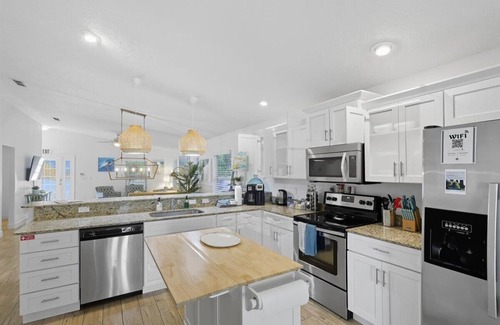 Palm Coast Casa | 3BR Coastal Home + Heated Pool, Golf Cart & Bikes