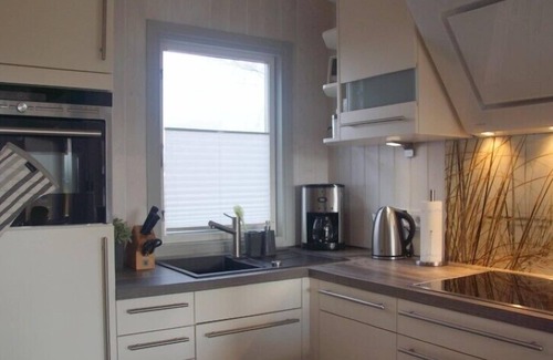 Norderteil Casa | 4 person luxury holiday home with sauna, wood-burning stove, air conditioning, canoe and lake view in Otterndorf