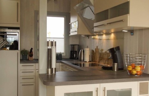 Norderteil Casa | 4 person luxury holiday home with sauna, wood-burning stove, air conditioning, canoe and lake view in Otterndorf