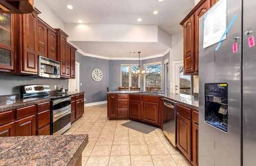 Grove Casa | 5-Bedrooms on the water! 2 Kitchens, Hot Tub, and Theatre!
