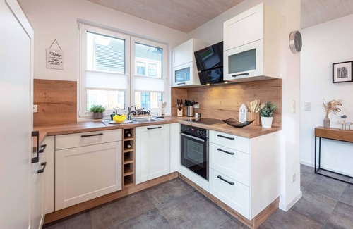 Fuhlendorf Casa | 5-star vacation home Ostseetraum on the water with fireplace, terrace and Bodden view