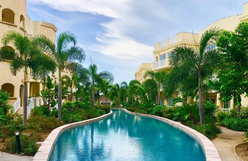 Cotton Ground Condominio | 50 yardas de la playa, estas actualizaciones te hacen sentir como en casa