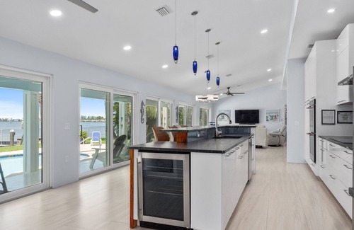 Fort Pierce Casa | 5BR/4.5B Beach House- heated pool, deep water dock, walk to beach!
