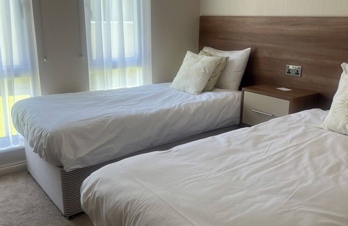 Llanarth Cabina | 71 The Beech House Lodge - A fabulous woodland and coastline escape.