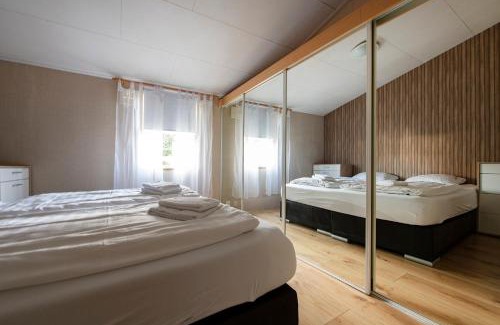 Oisterwijk Chalet De Esquí | 79, Ruime chalet aan de Kampina