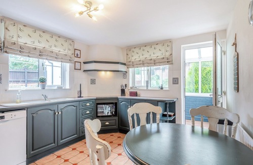 Saxthorpe Cabaña | A spacious, bright property with a large inglenook fireplace and lovely furnishings.