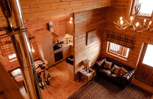 Gorebridge Cabina | A traditional Scandinavian style lodge, with stylish wooden interior decorated with a Scottish theme