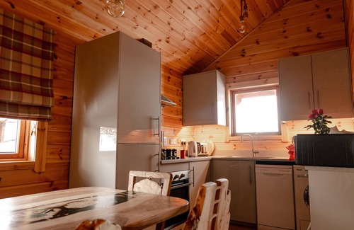 Gorebridge Cabina | A traditional Scandinavian style lodge, with stylish wooden interior decorated with a Scottish theme