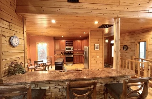Tellico Plains Cabina | A true log cabin with 360 degree mountain views - Pet and Motorcycle friendly! 5 Bedroom Cabin by RedAwning