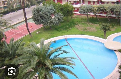 Daimuz Apartamento | Acogedor apartamento en Daimús a 150 metros de la playa con parking privado y piscinas comunitarias