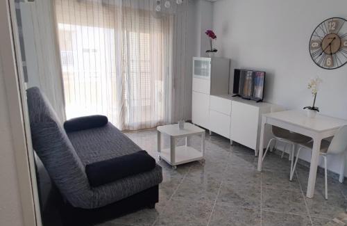 Daimuz Apartamento | Acogedor apartamento en Daimús a 150 metros de la playa con parking privado y piscinas comunitarias