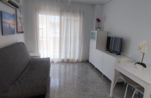 Daimuz Apartamento | Acogedor apartamento en Daimús a 150 metros de la playa con parking privado y piscinas comunitarias