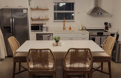 Medicine Park Cabaña | Acorn Cottage: bright luxury boho home with large outdoor fenced patio area!