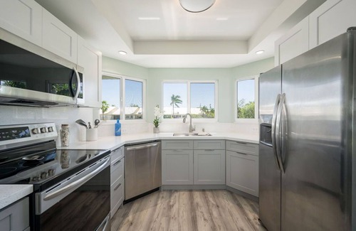 Key West Casa | 3BD/2BA Waterfront Townhome w/ Open Water Views, Beach, and Waterside Pool.