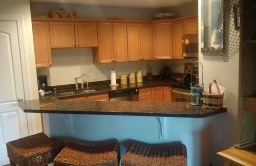 Yaupon Beach Condominio | Adorable condominio de playa de dos dormitorios con playa privada, piscina y jacuzzi