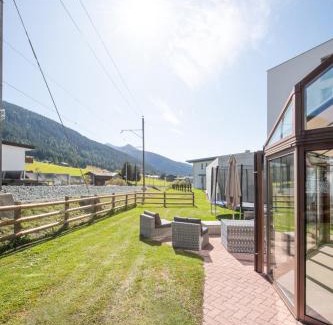 Davos Apartamento | Agrimonia - 5,5-Zi Duplex Wohnung bis 11 Personen mit eigenem Garten