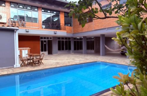 Guarulhos City Centre Casa | Airport Stay Guarulhos – 600m Bosque Maia, Wi-Fi, Estacionamento, Sala de Espera, piscina, Check-in Facial