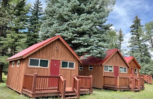 Alamosa Cabina | AIYM Camp Riverfront Cabin #2. In the Rio Grande National Forest, Alamosa Canyon