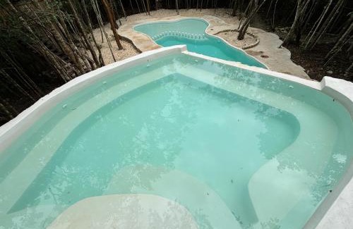 Puerto Morelos Otro | Aldea Maya-Ha Cabañas con cenotes