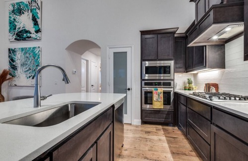Denton County Casa | Amazing upgraded masterpiece with a nice gym upstairs, full kitchen, and games!