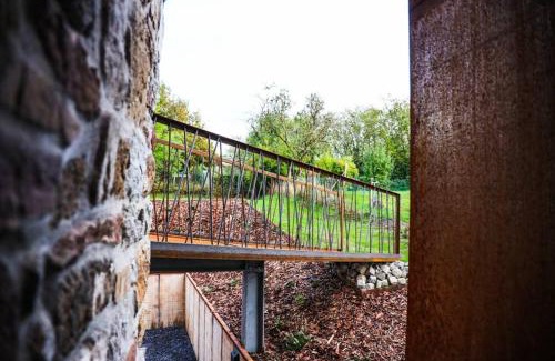Marche-en-Famenne Casa | Amazon Corten
