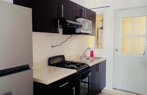 Puerto Juarez Apartamento | Amplio Departamento a 10 Min de la Playa con Alberca e Internet