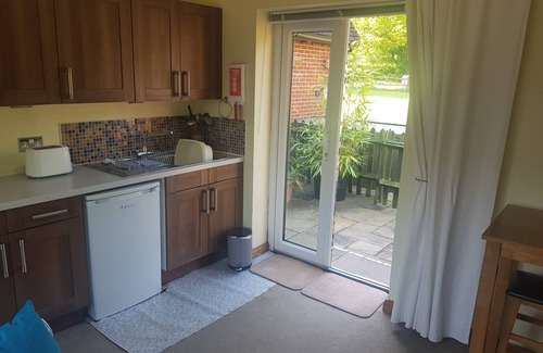 Slinfold Apartamento | Anexo con vistas al campo, bañera de hidromasaje, WiFi gratis y aparcamiento en la calle