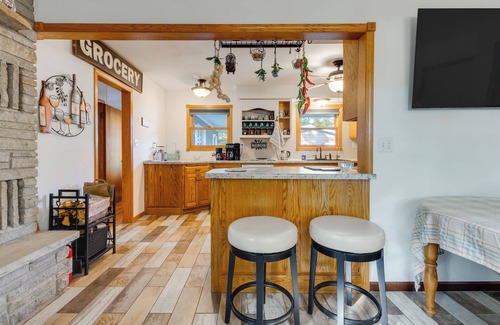 Waupaca Casa | Antiquing & Fishing: Riverfront Waupaca Home!