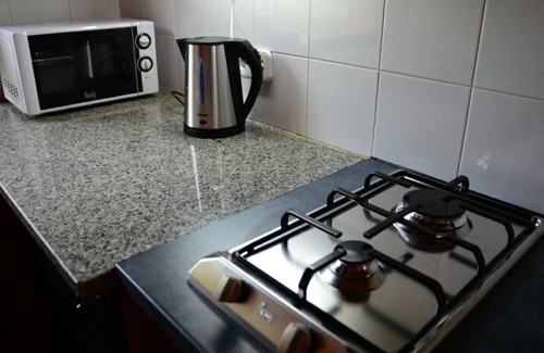 Tortella Casa | Apartamento para 8 personas en casa rural. La Garrotxa.Piscina compartida.