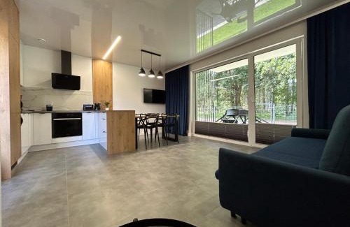 Ustka Apartamento | Apartamenty w sam las by KLIF Ustka - apartament na parterze z tarasem i parkingiem