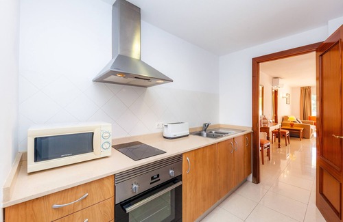 Cala Bona Apartamento | Apartamento 'Apartamento Espiga' con piscina compartida, Wi-Fi y aire acondicionado