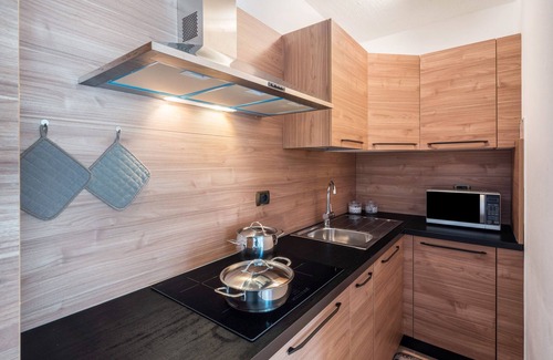 Rocca Pietore Apartamento | Apartamento 'Appartamento Bilocale 2' con vistas a la montaña, jardín compartido y Wi-Fi