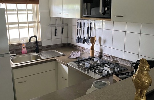 Willemstad Apartamento | Apartamento BonBininaCuracao Gran piscina en un resort tropical vigilado