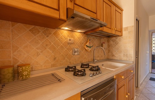 Li Cuncheddi Apartamento | Apartment 'Casa Vacanze Ciliegio' with Sea View, Shared Pool and Air Conditioning
