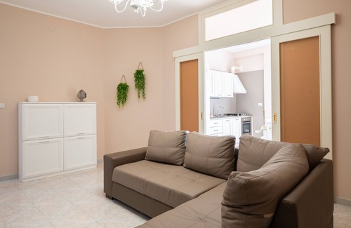 Pulsano Apartamento | Apartamento 'Casa Vacanze Francesco' con balcón, Wi-Fi y aire acondicionado
