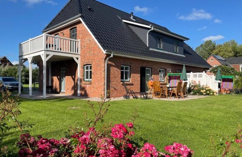 Pellworm Apartamento | Apartamento 'Ferienhaushälfte Hafenperle' con jardín compartido y Wi-Fi