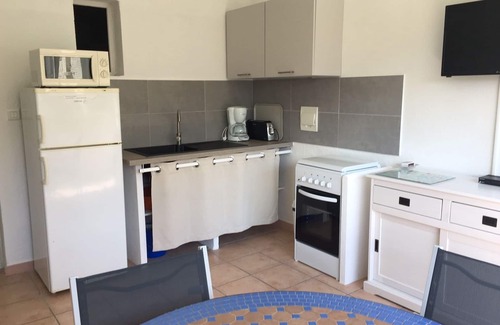 Favone Apartamento | Faounzina, 4 pers, 1 ° piso, frente al mar con acceso directo a la playa